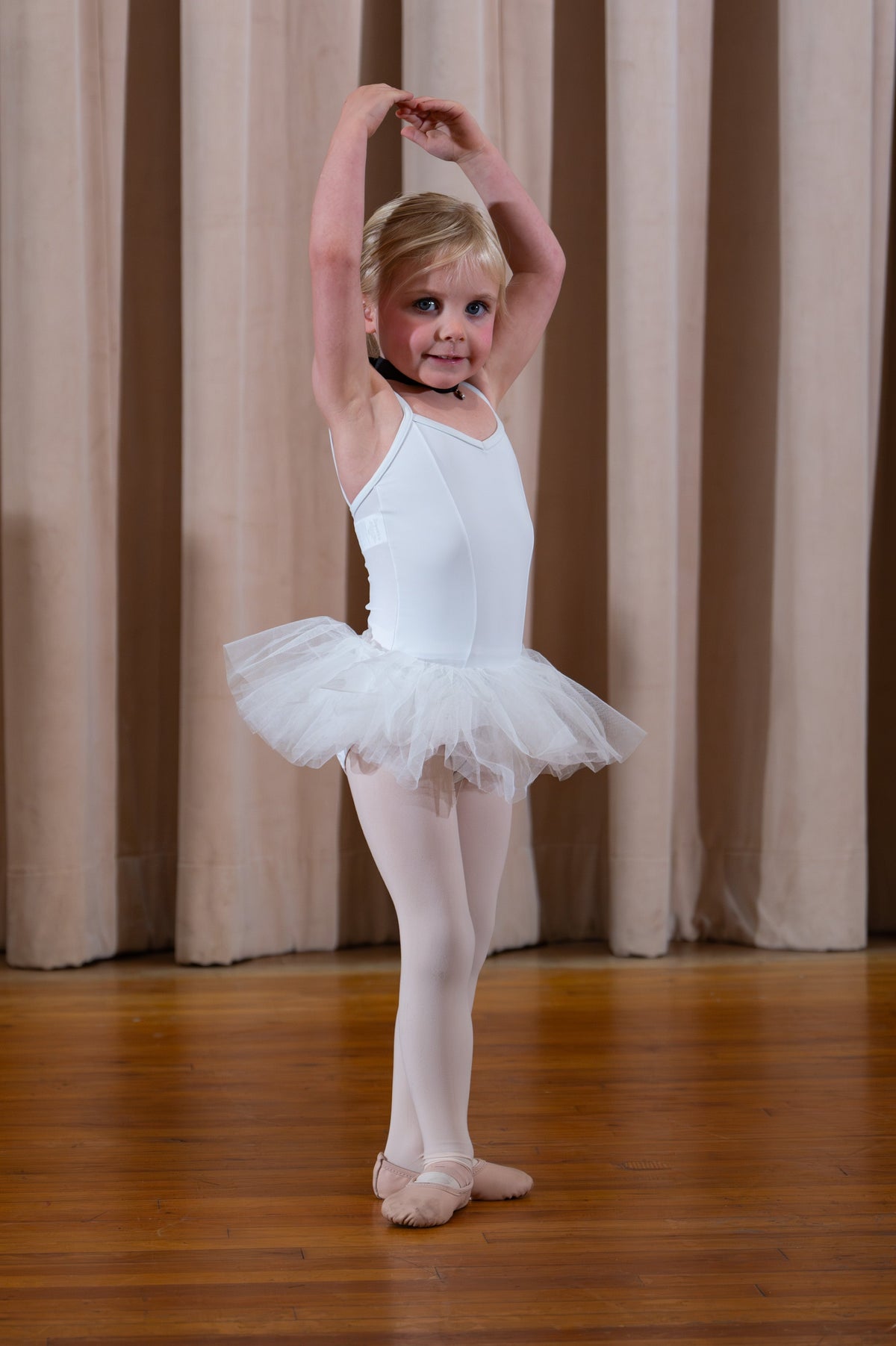 A little ballerina in a white tutu
